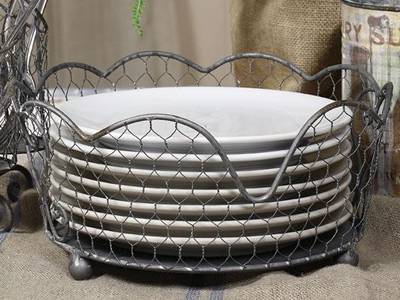 A galvanized chicken wire basket is placed here to contain dishes.