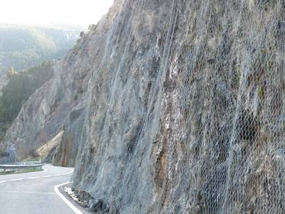 galvanized rock fall barrier protects slopes against landslides and insure the road safe