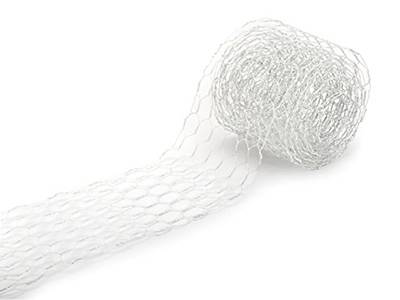 A roll of silver chicken wire ribbon is lying there with part of ribbon extended.