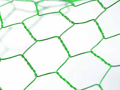 A piece of craft chicken wire in apple green color